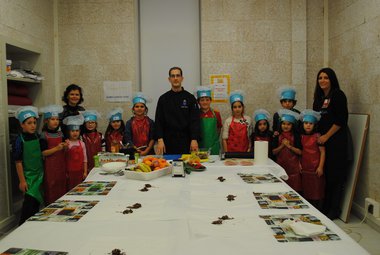 Children learn to cut vegetables in cooking workshop organised by Apehl these days